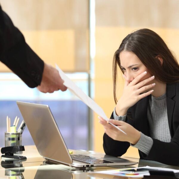 Worried businesswoman receiving notification
